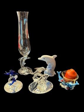 A Pod of Assorted Glass Dolphin Figurines and Dolphin Glass Bud Vase